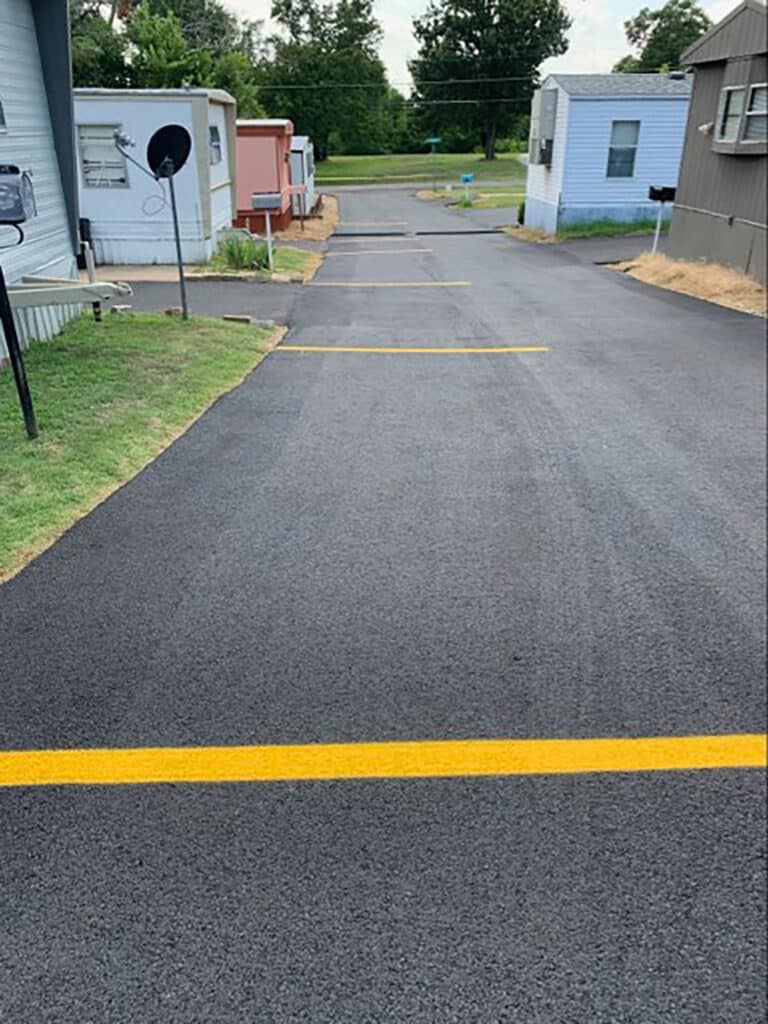 Everything You Need To Know About Asphalt Striping 3 Freshly installed lines for parking spaces in a local street.